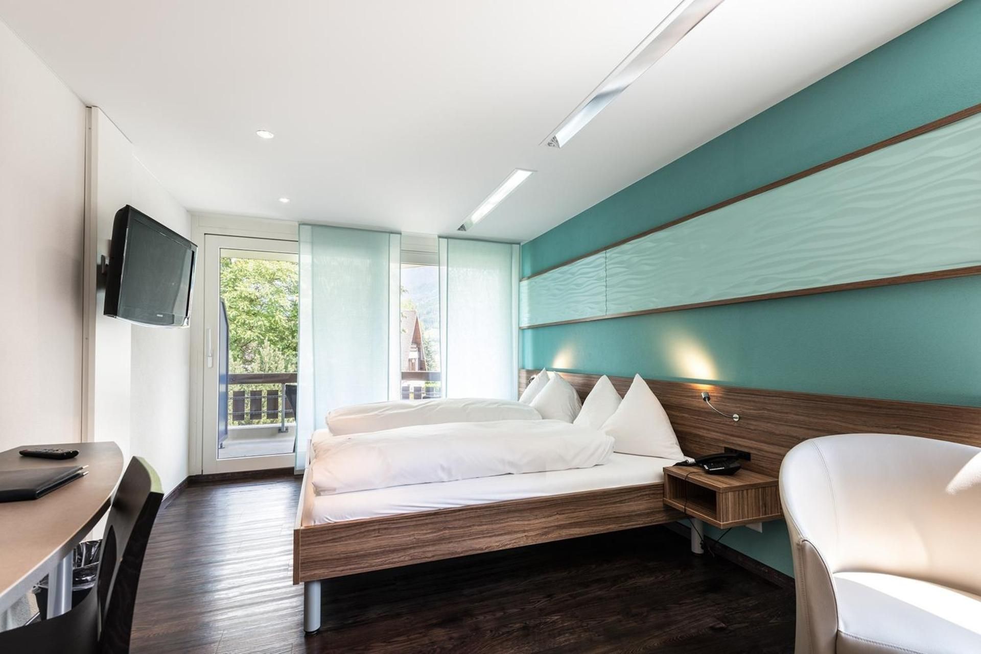 Hotel Nidwaldnerhof Family Room with 2 Bed Rooms and Village View 2