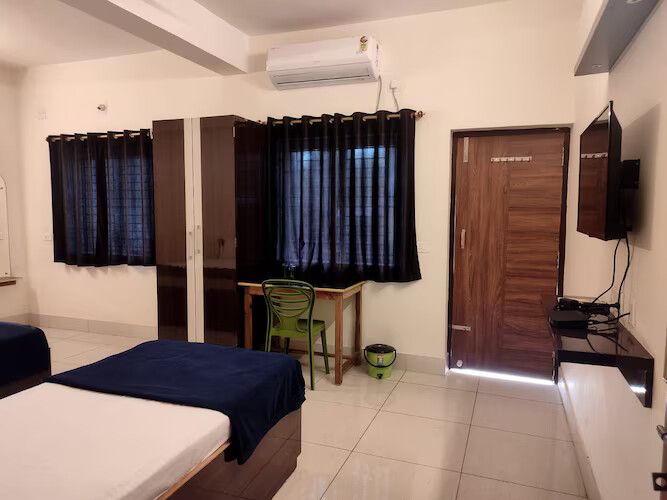Triple Ac Deluxe Room with Balcony