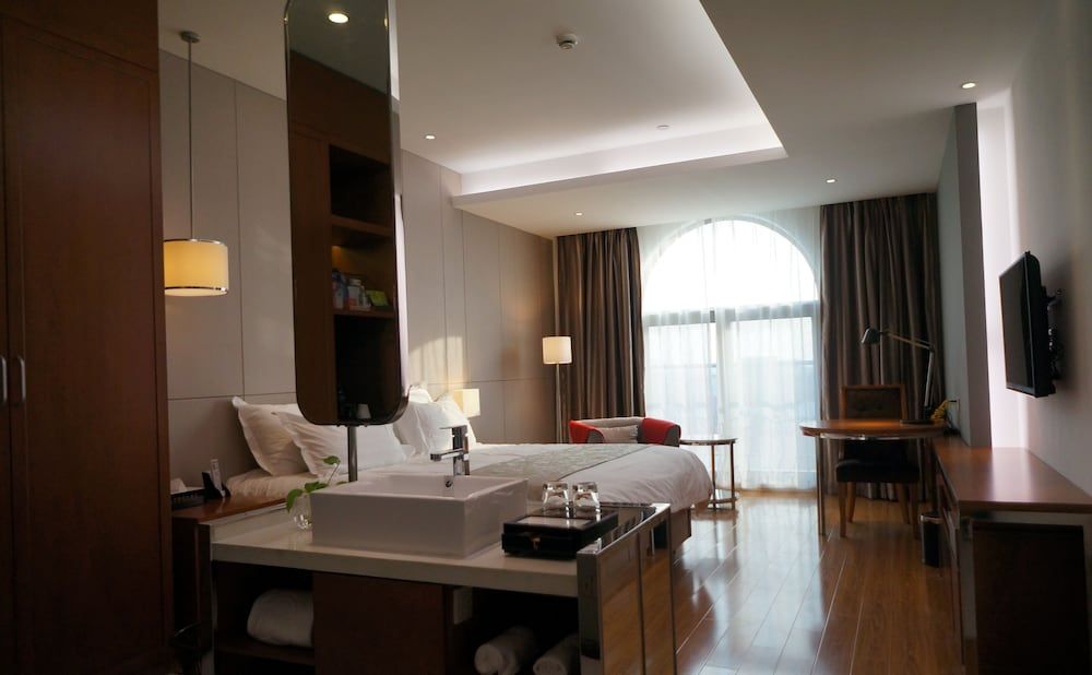 Baolong Homelike Hotel Changxing Branch