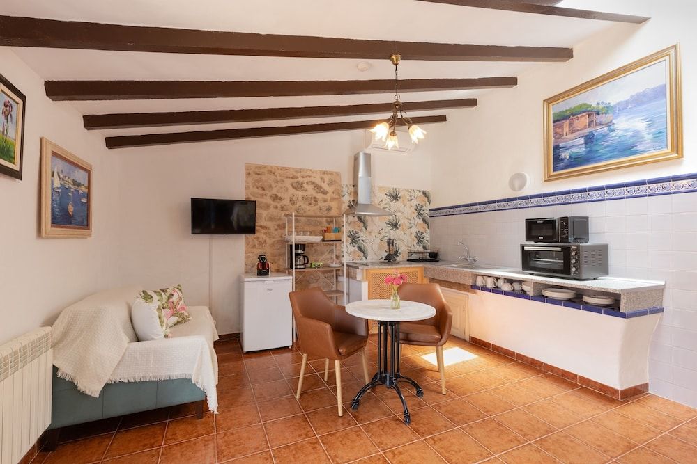Llebeig studio with terrace and pool and garden view