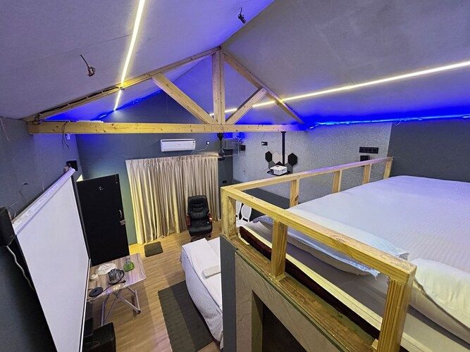 Deluxe Cottage King Bed with Home Theater and Bug Bed Forest View