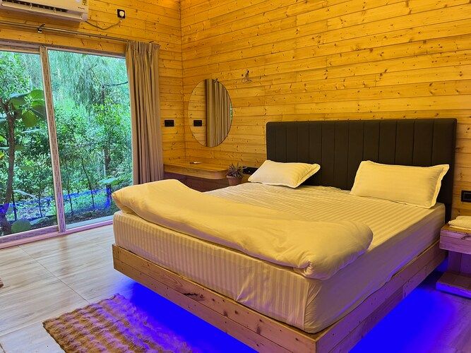 The Urban Escape (By Saubhagya Mangalam) Deluxe Pinewood Cottage King Bed with Bug Bed Forest View 4
