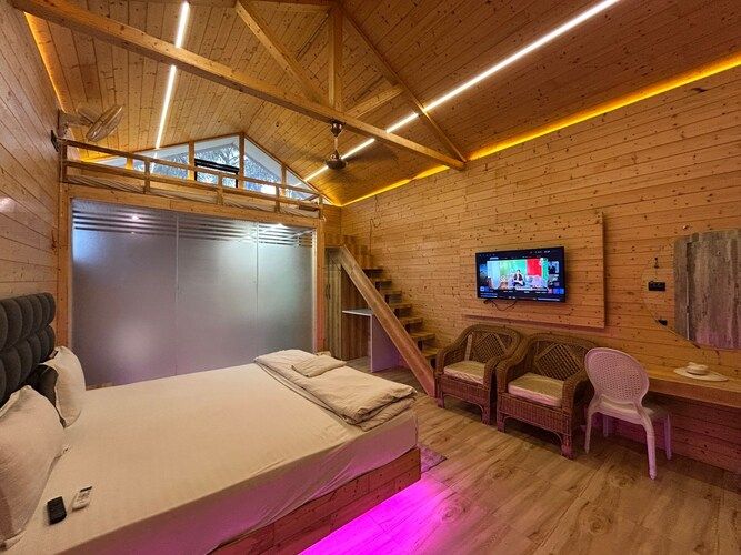 The Urban Escape (By Saubhagya Mangalam) Deluxe Pinewood Cottage King Bed with Bug Bed Forest View