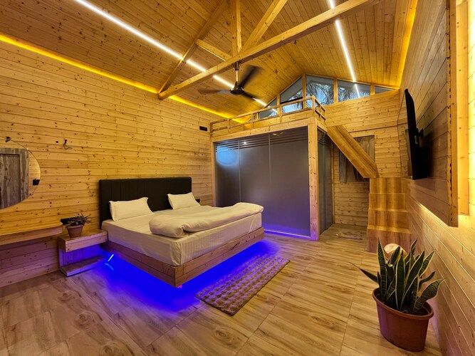 The Urban Escape (By Saubhagya Mangalam) Deluxe Pinewood Cottage King Bed with Bug Bed Forest View 3