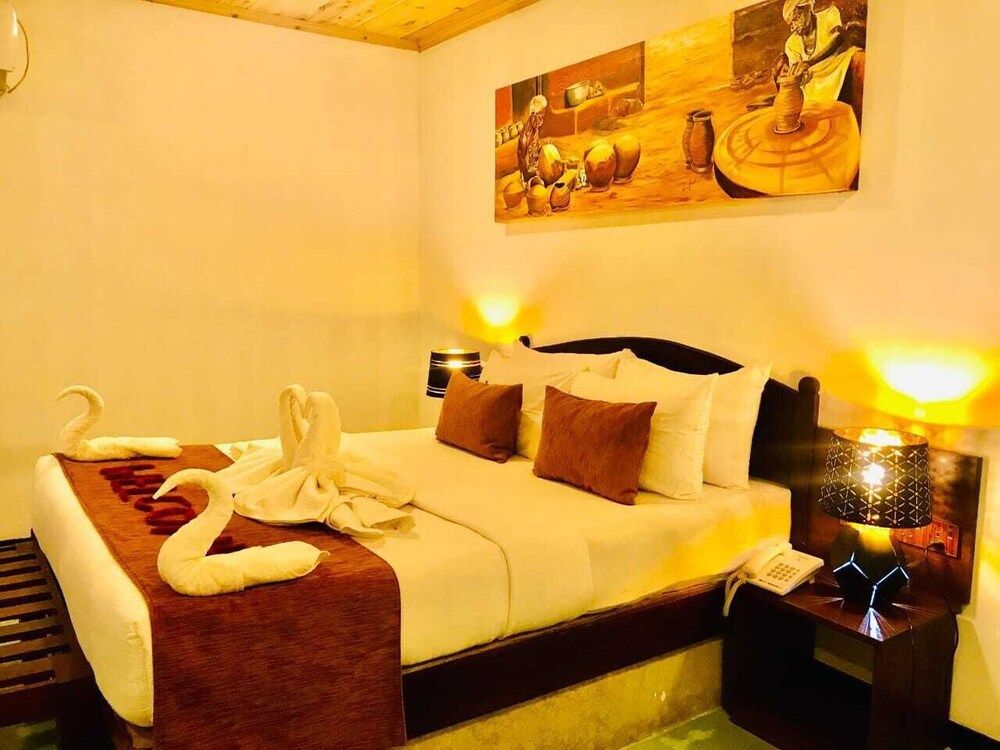 NATURALIZA Deluxe Double Room, Balcony, Garden View 3