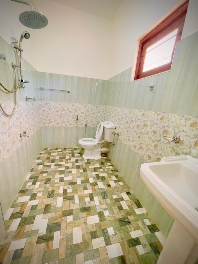 Cinnamon Tree Comfort Quadruple Room, Patio, Garden View 4