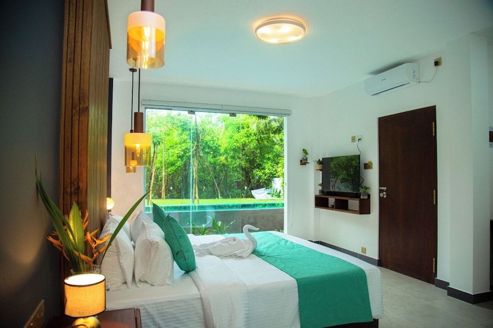 Aaradhya Madu River Deluxe Double Room, Balcony, River View 2