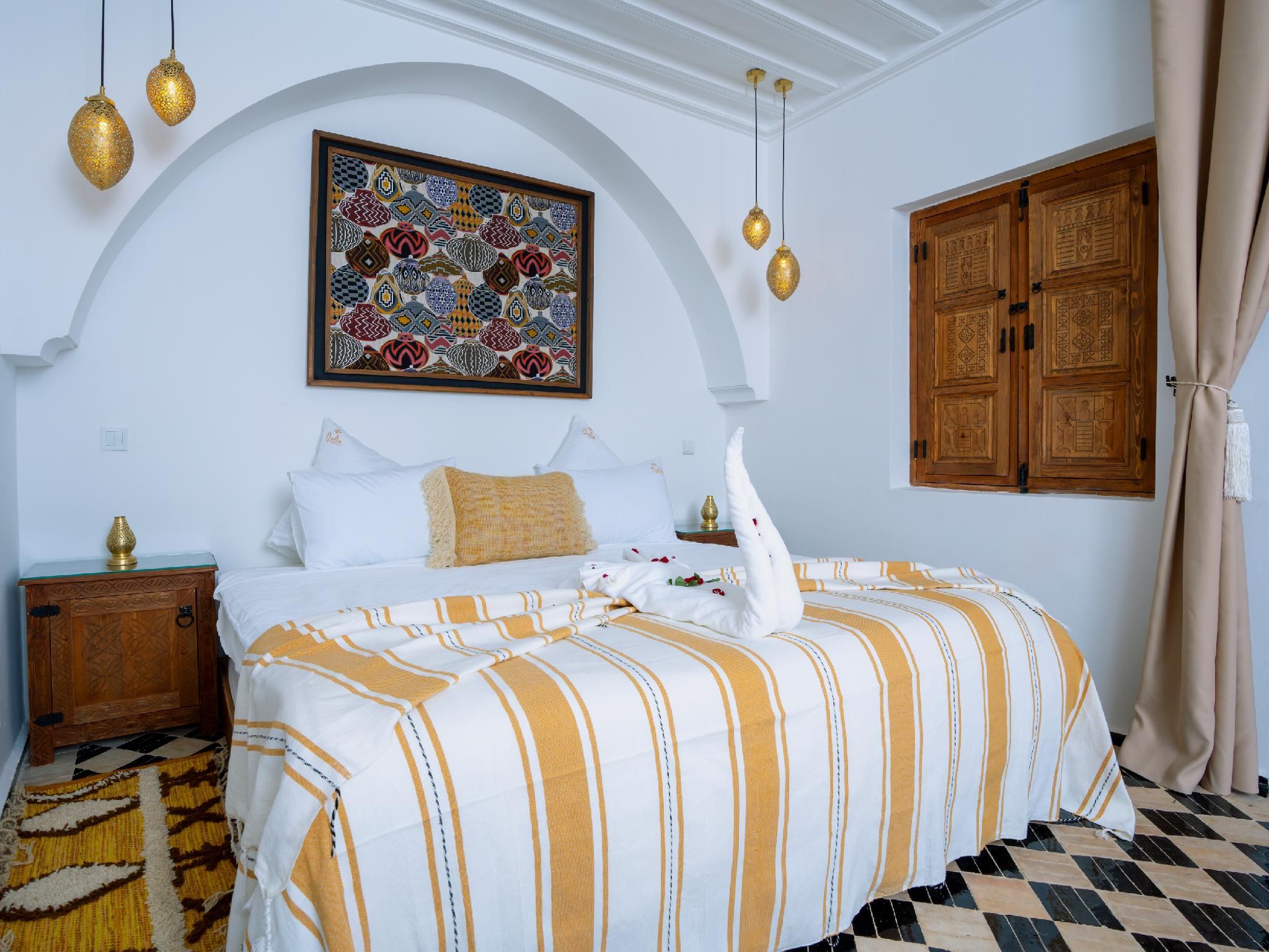 Nelia Signature- Deluxe Triple Room