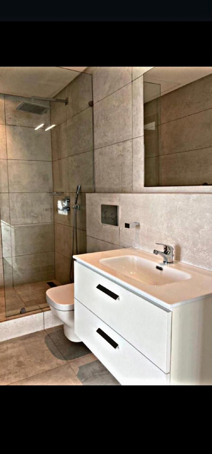 One-Bedroom Apartment with Balcony and City View