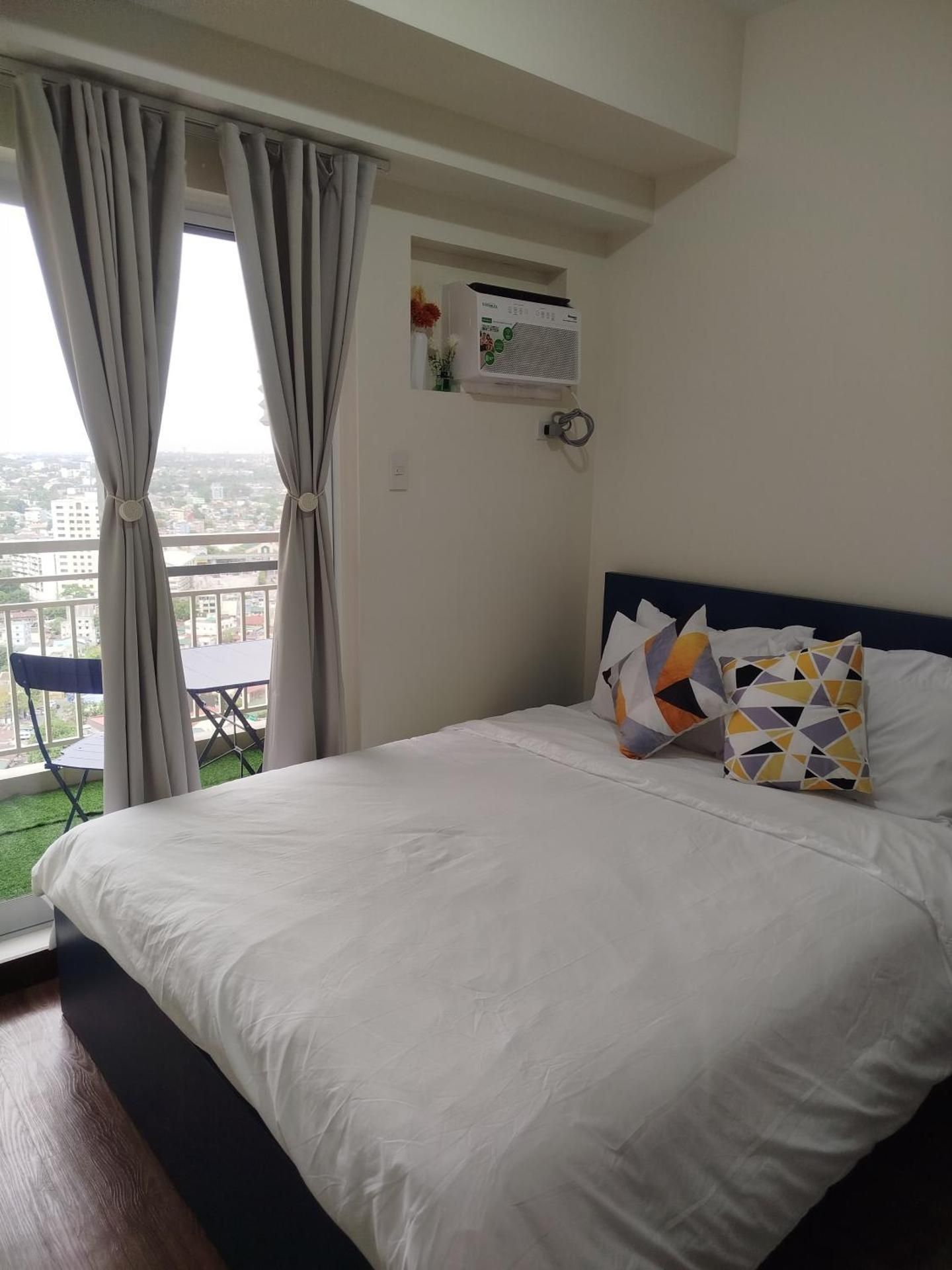 One-Bedroom Apartment with Balcony and City View