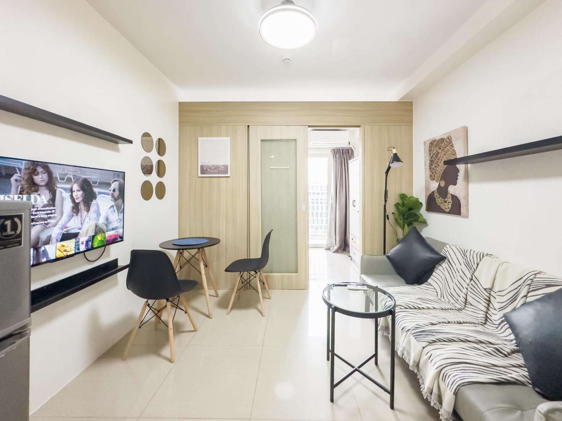 One-Bedroom Apartment with Balcony and City View