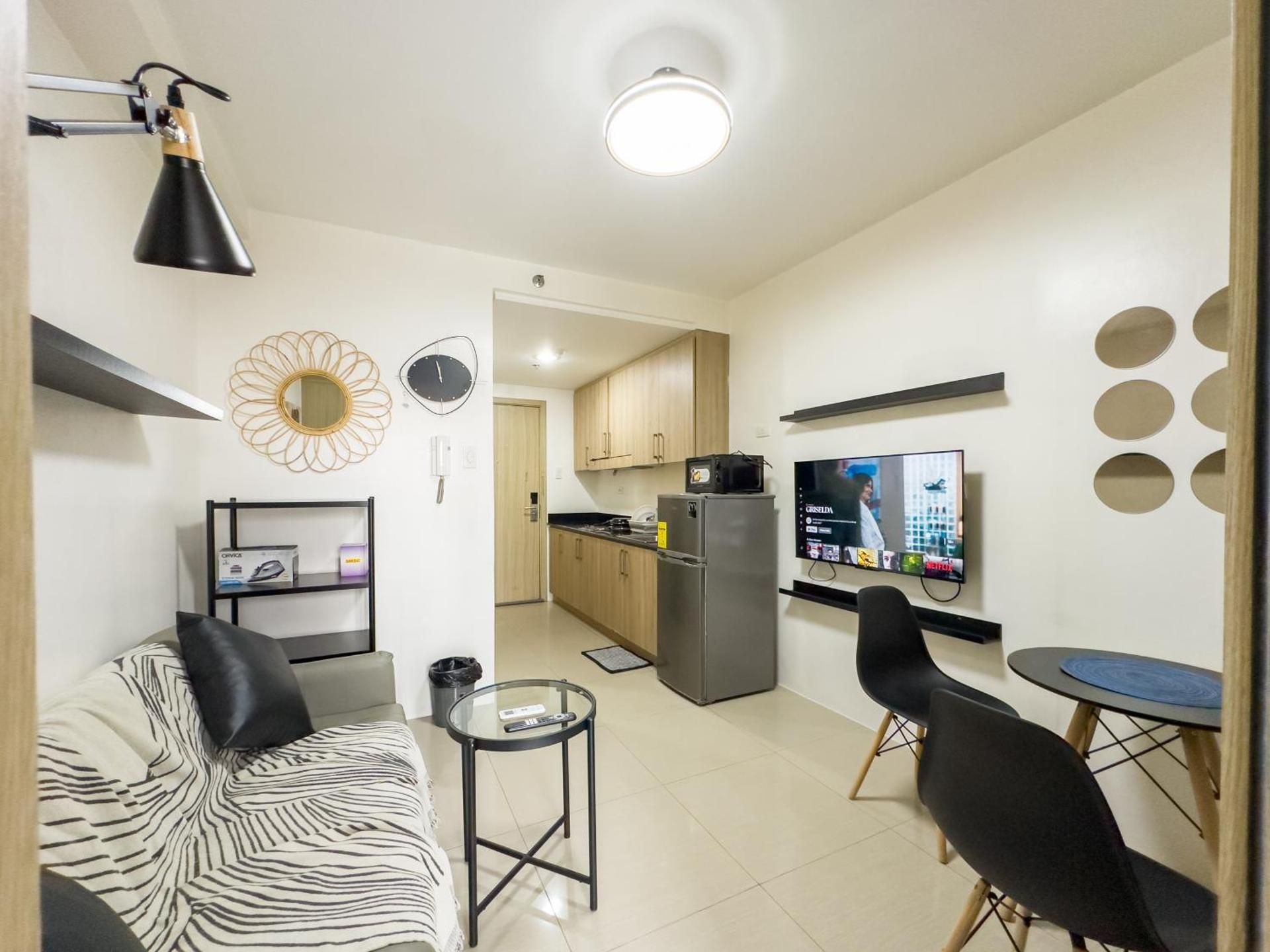 One-Bedroom Apartment with Balcony and City View