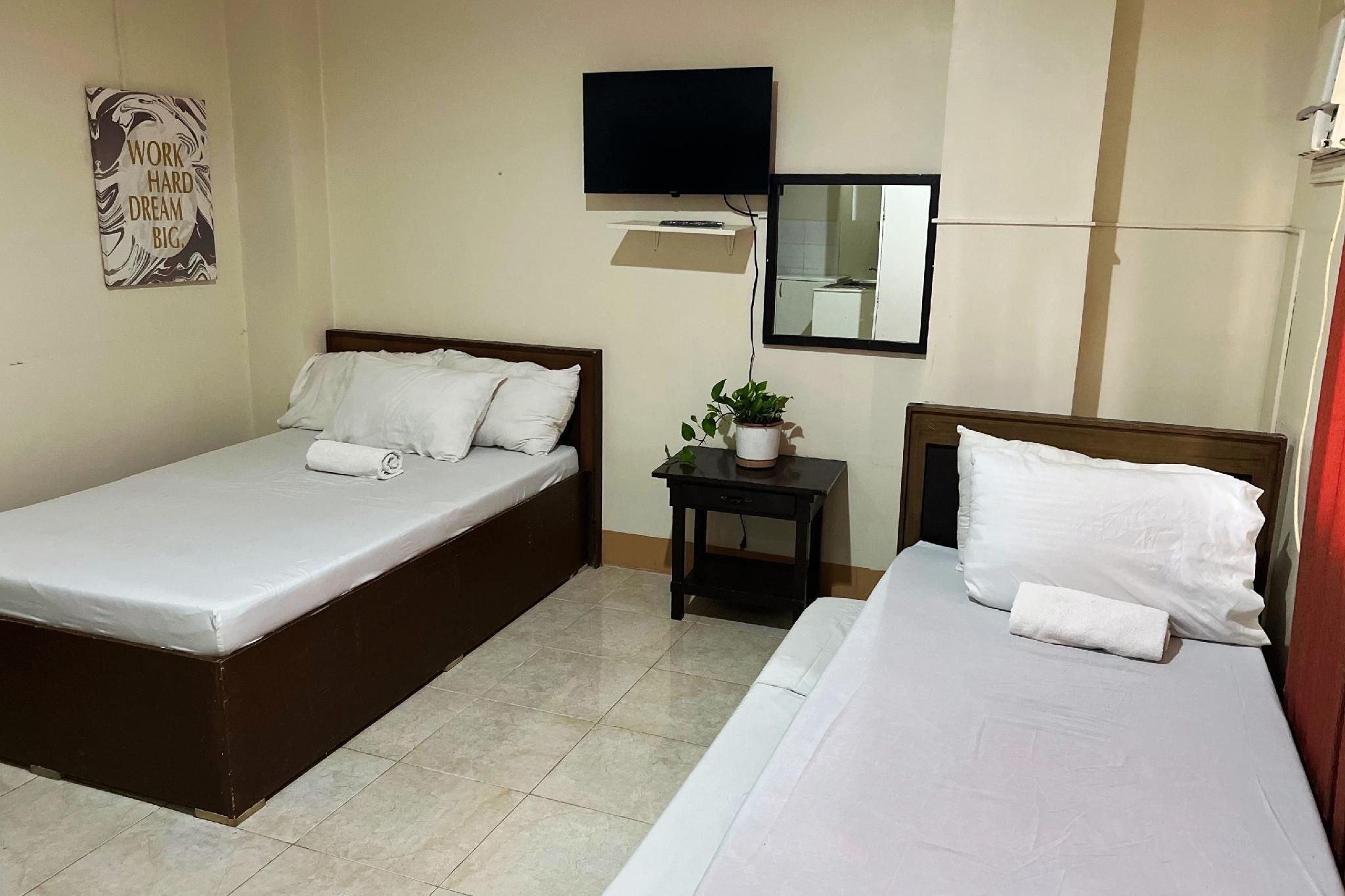 Sta Rosa Inn Iloilo powered by Cocotel Quadruple Room