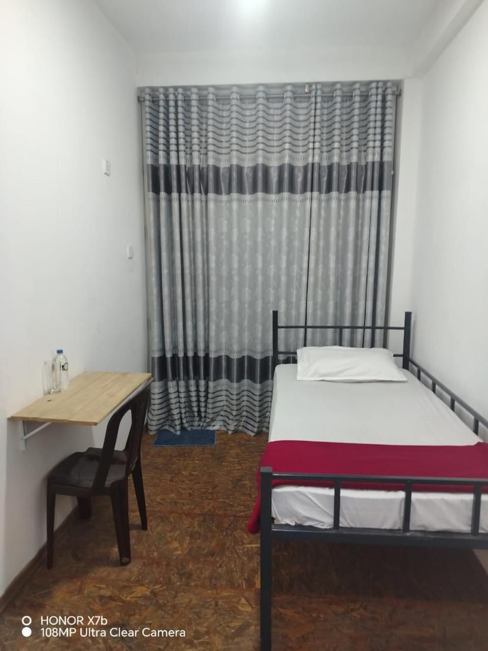Single Bed in Dormitory Room