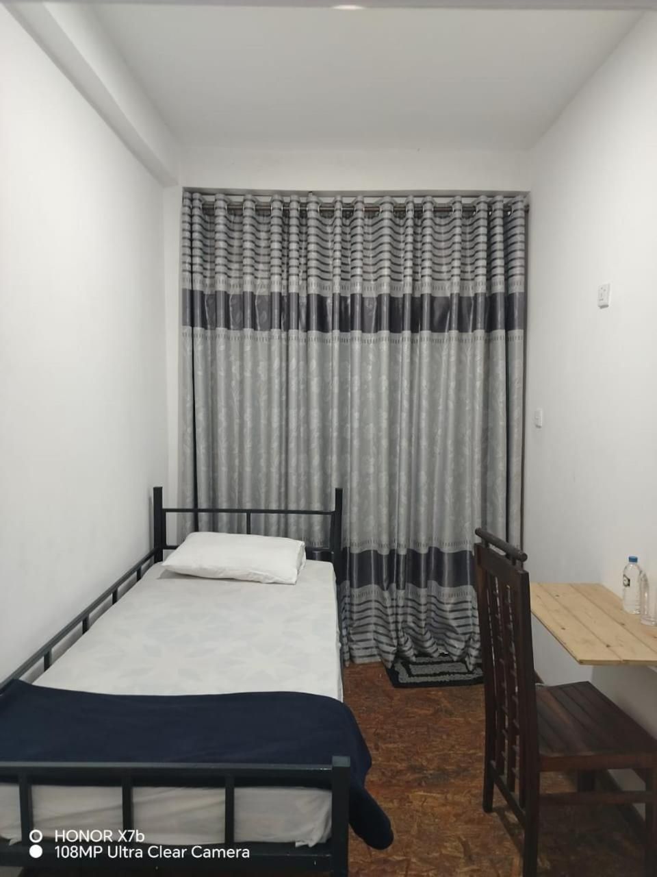 Single Bed in Dormitory Room