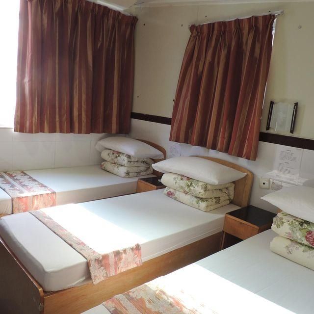 Guan Zhou Inn Deluxe Triple Room