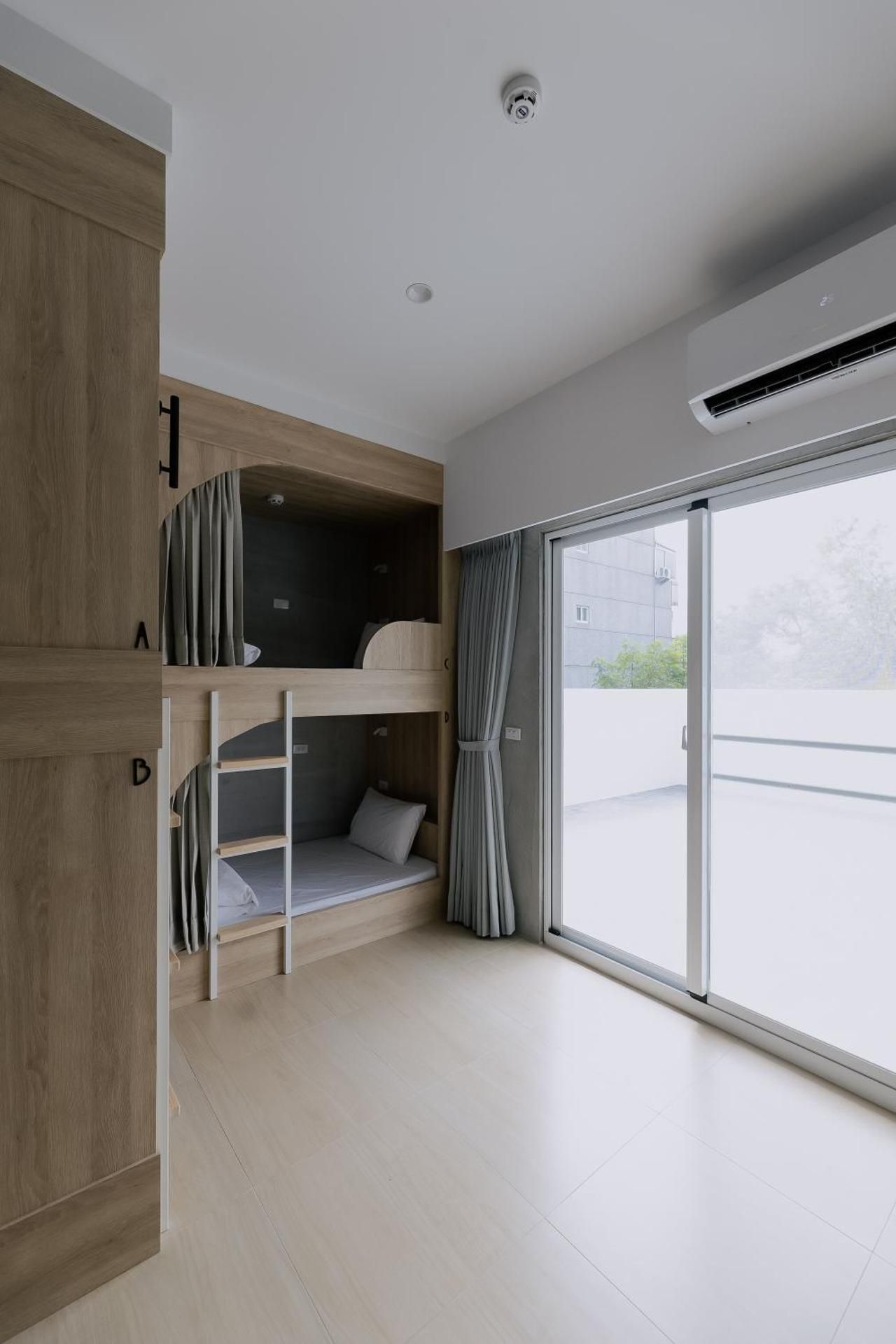 A Bed in All-Male Dormitory Bedroom