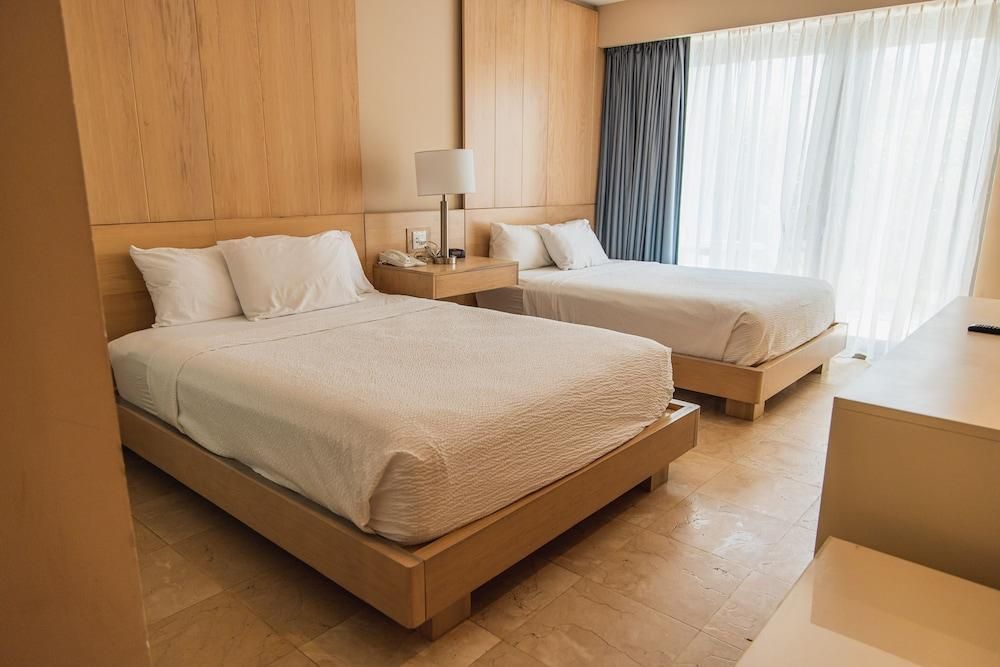 Queen Room with Two Queen Beds and Garden View