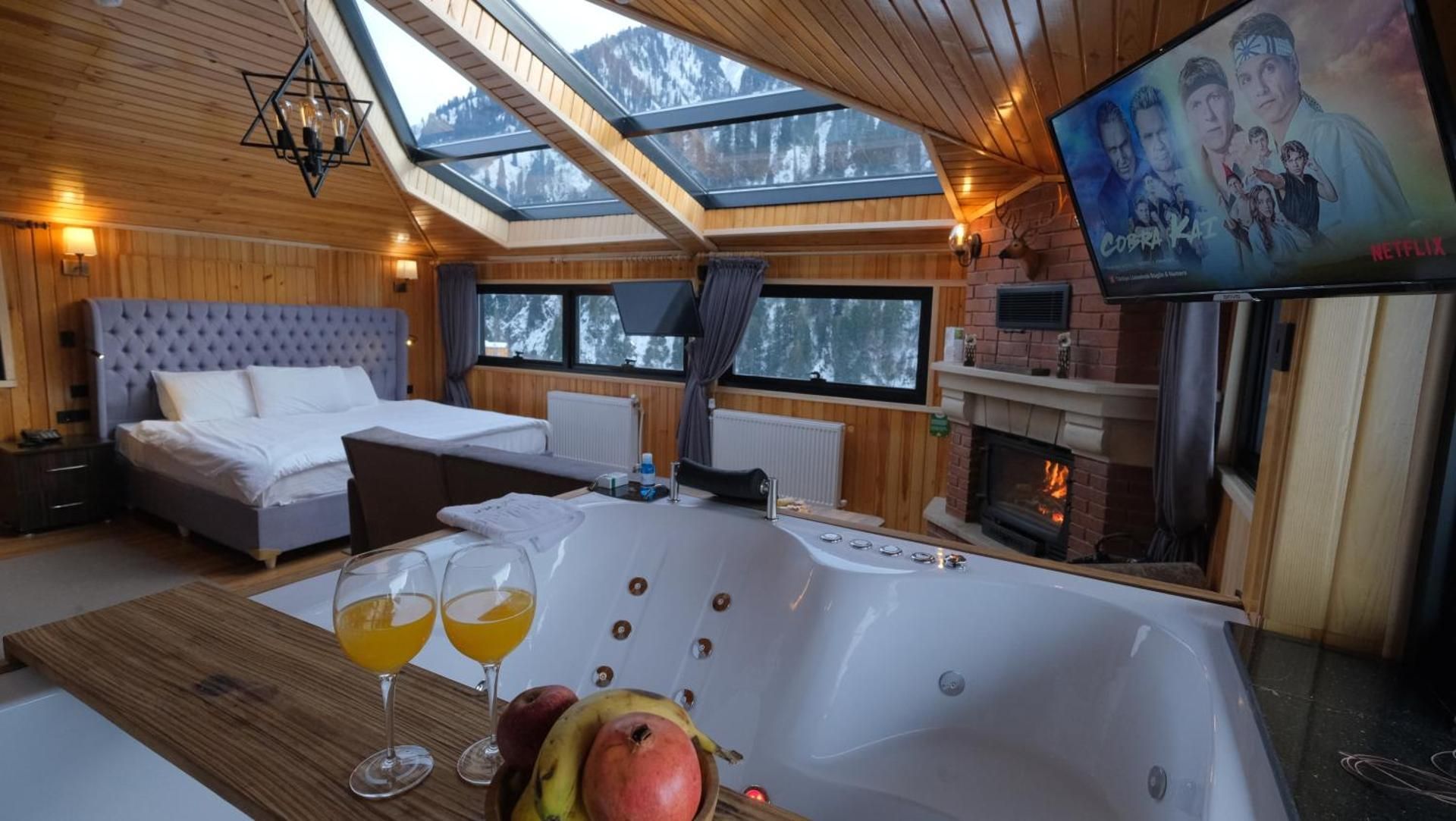 Junior Suite with Fire Place and Hot Tub - Waterfall View
