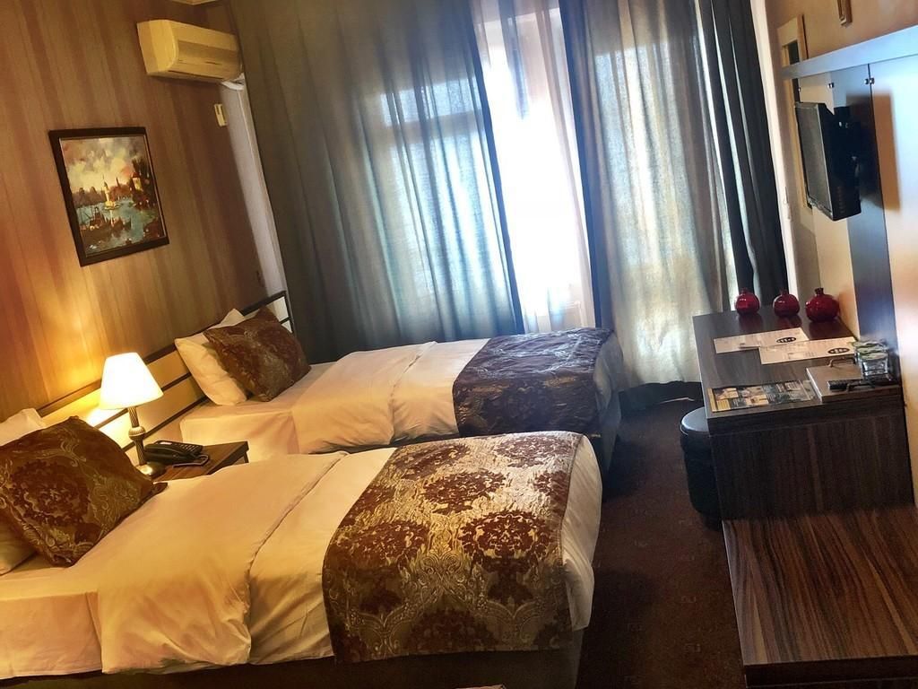 Deniz Manzaralı 3 Kişilik Deluxe Oda