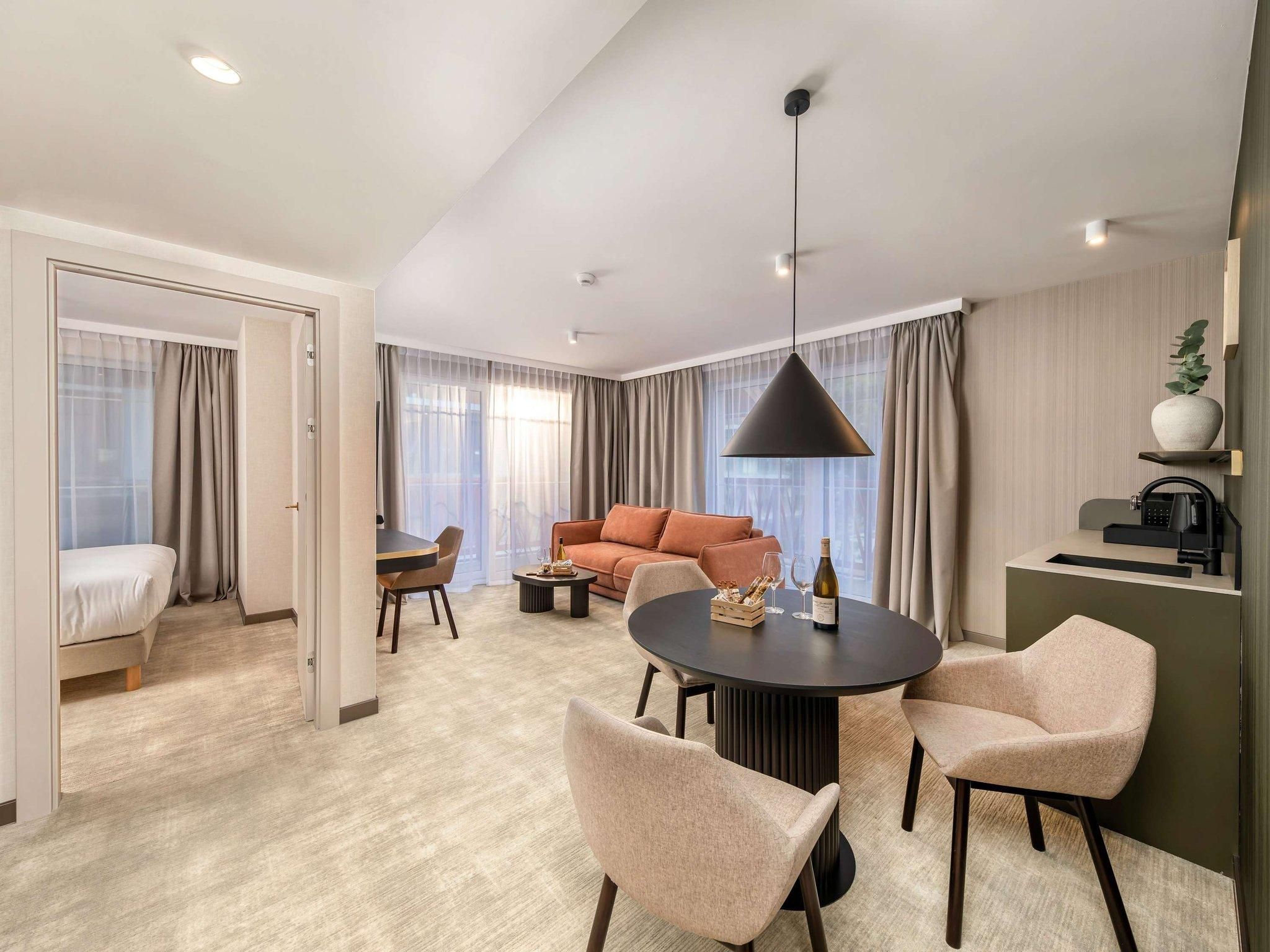 Junior Suite with two double beds and sofa bed