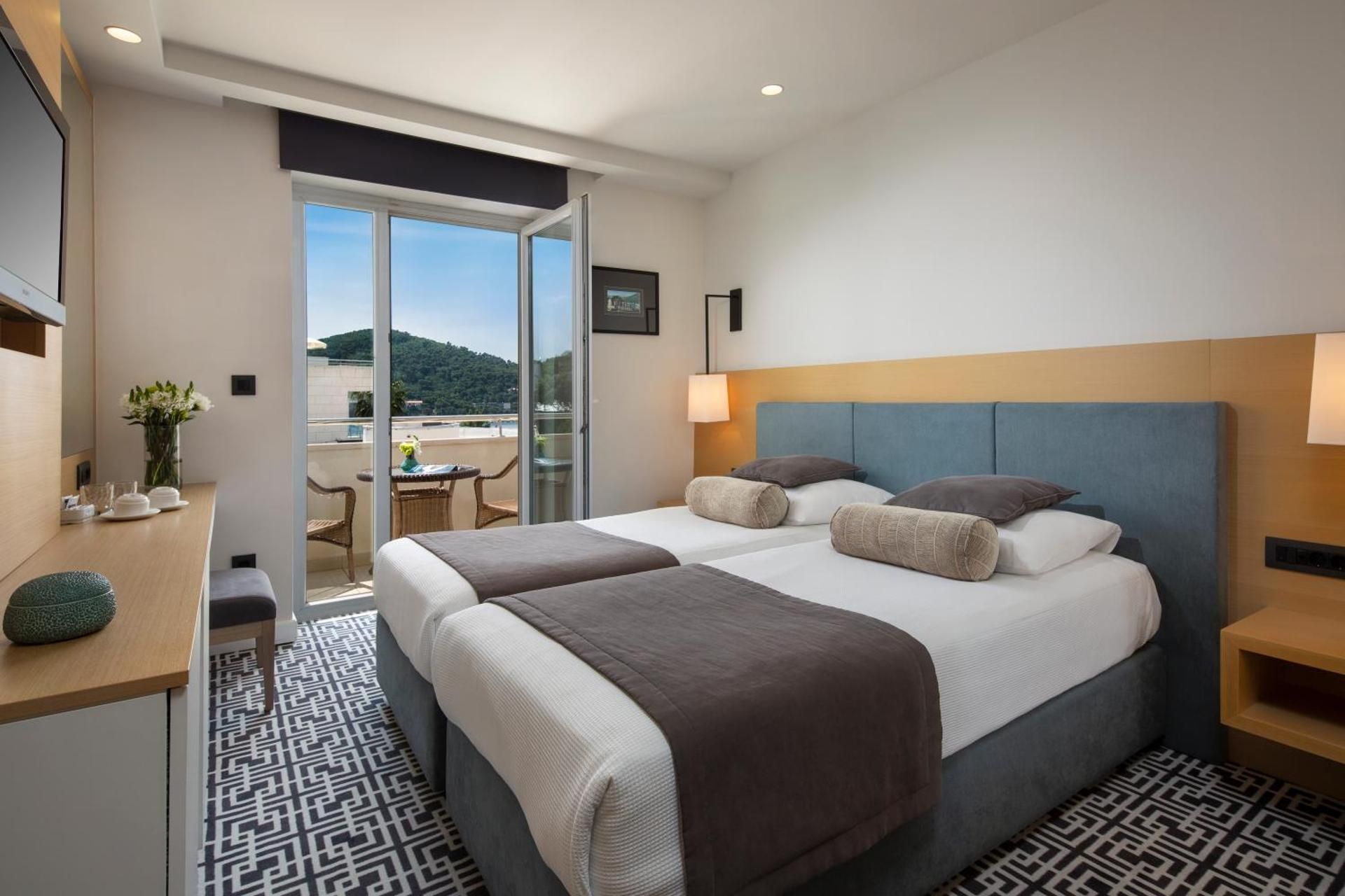 Double or Twin Room with Balcony and Side Sea View