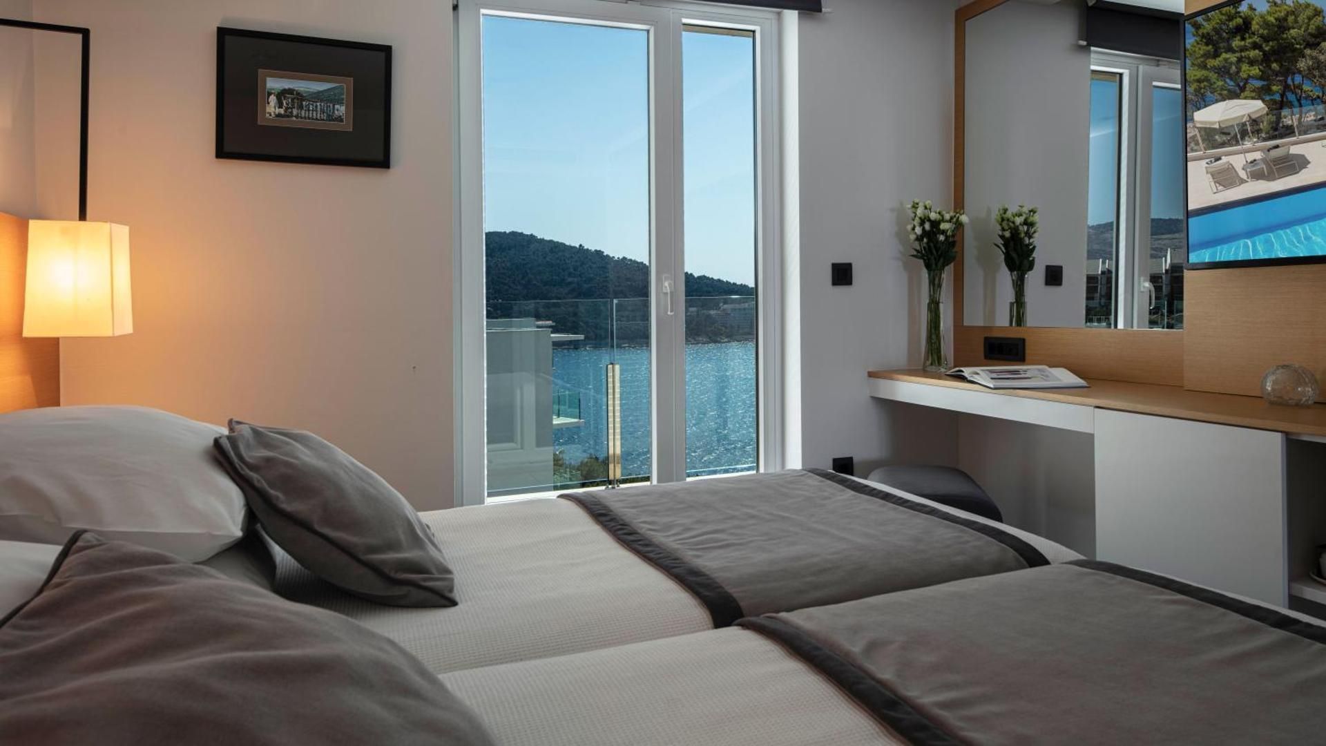 Double or Twin Room with Balcony and Side Sea View
