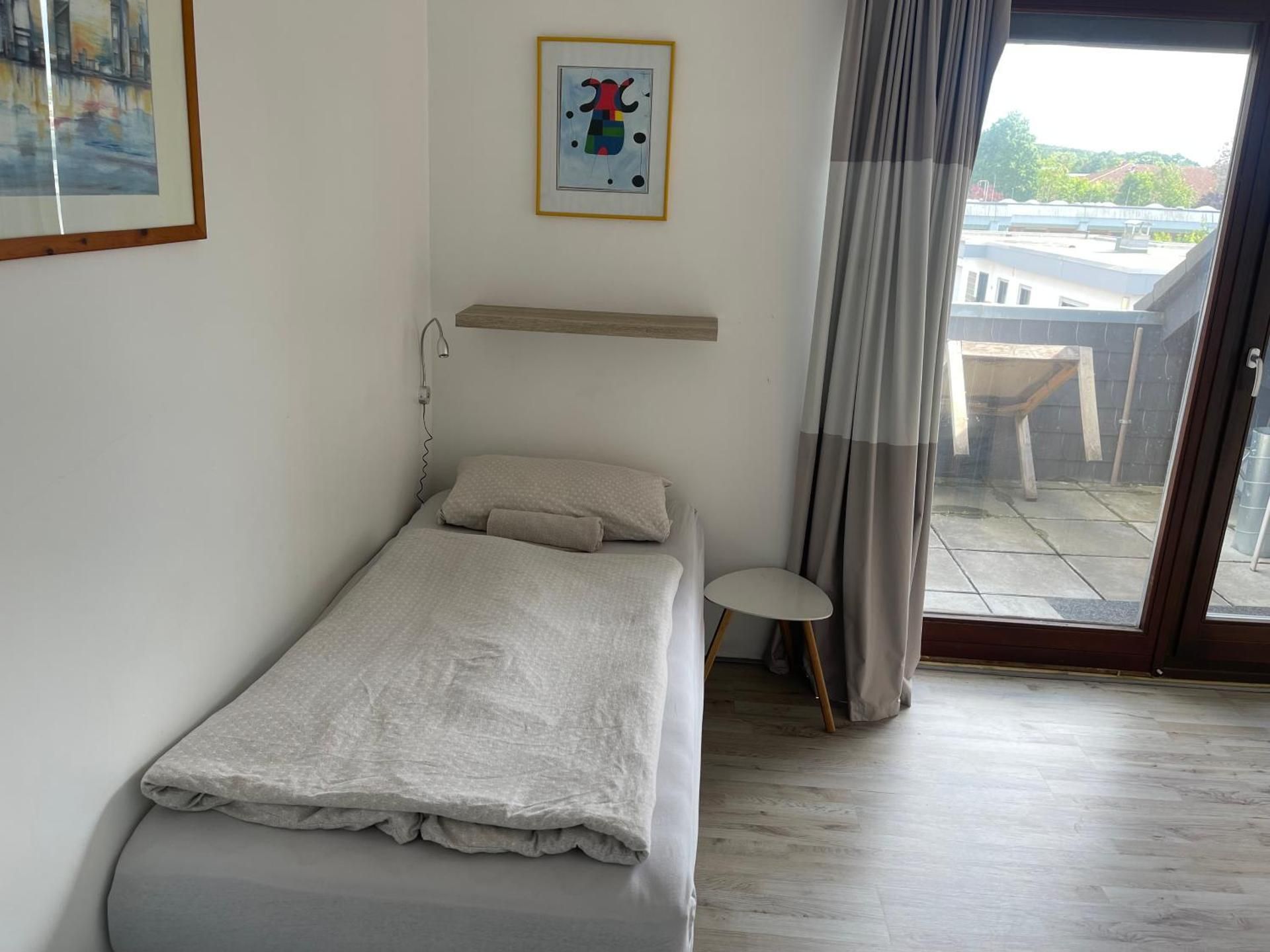 Four-Bedroom Apartment with Balcony 