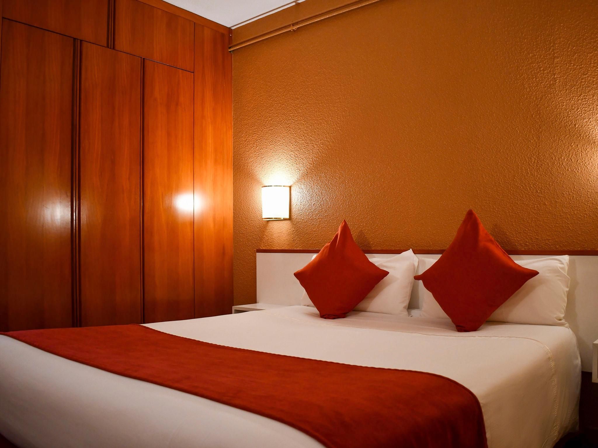 Standard room with one double bed and two single beds