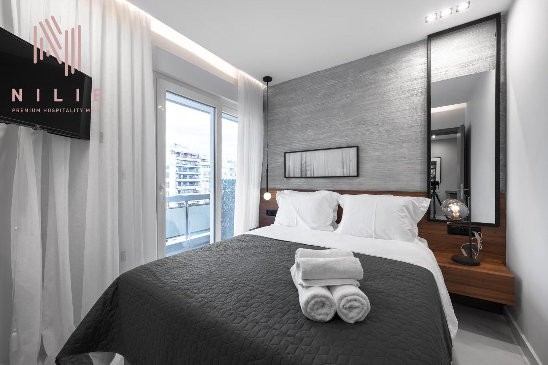 One-Bedroom Apartment with Balcony and City View