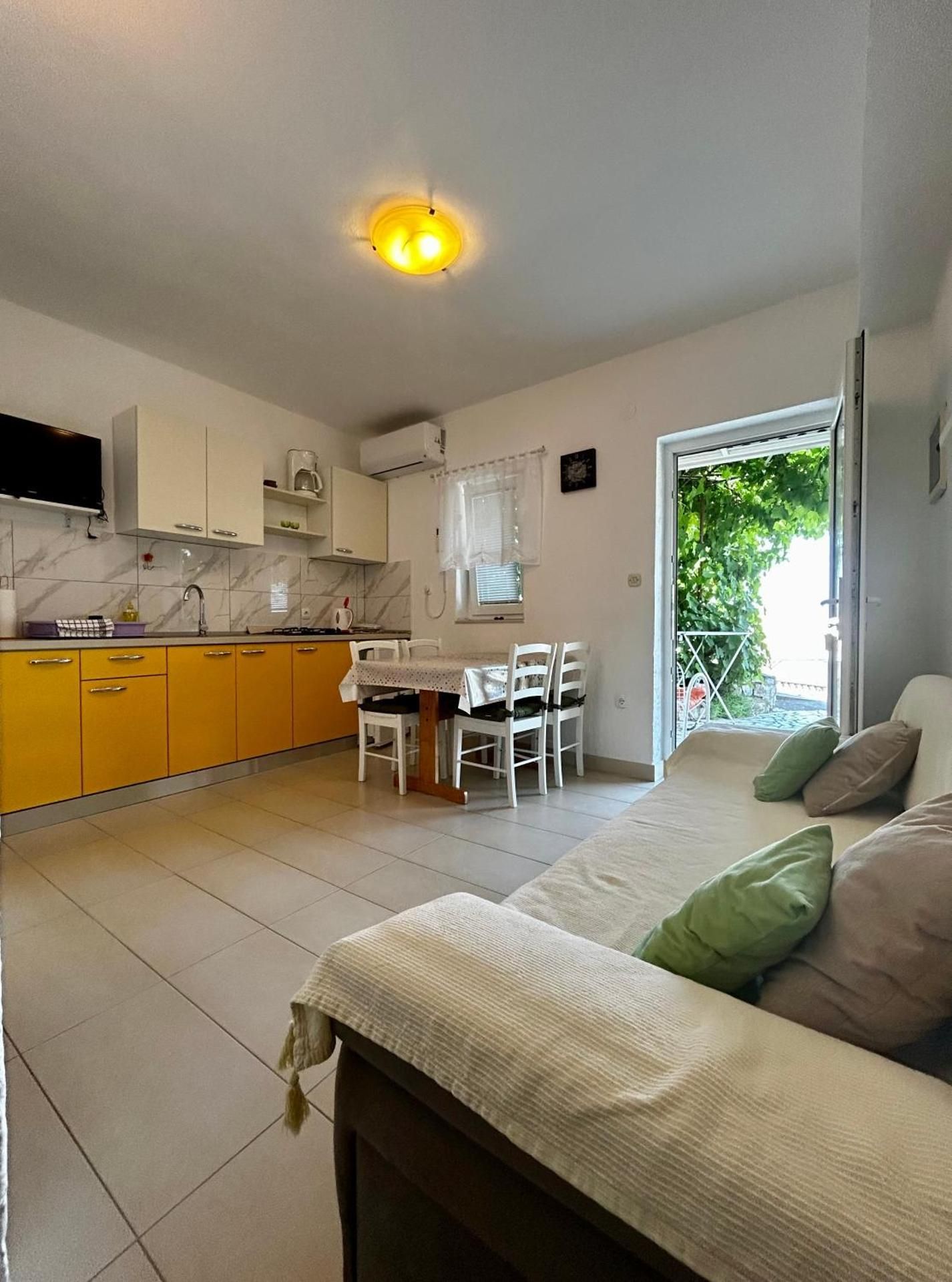 One-Bedroom Apartment with Patio and Sea View