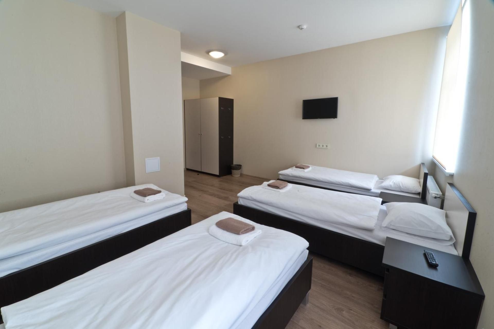 Quadruple Room with four single beds