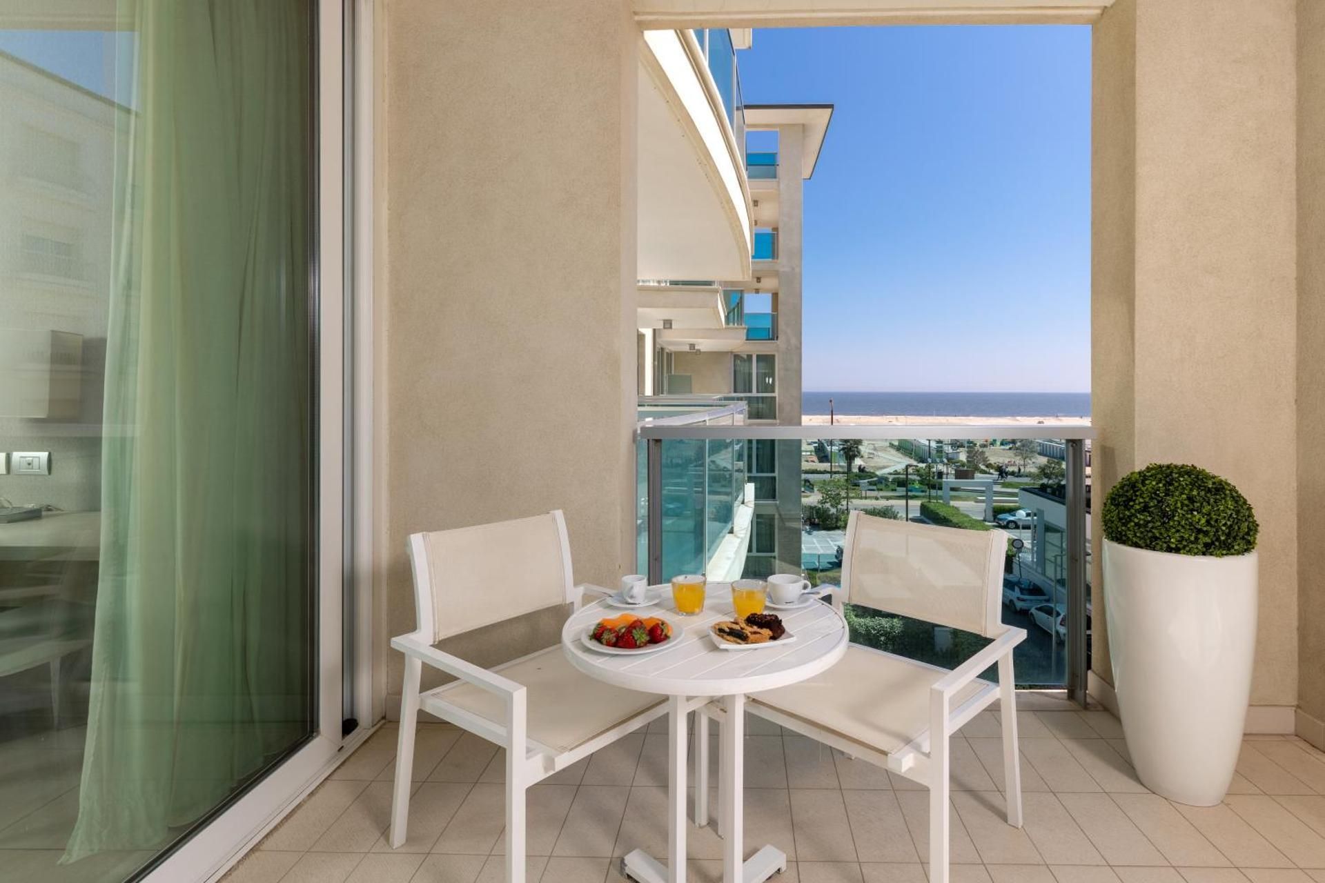 Classic Room with double bed and a pleasant balcony with side sea view