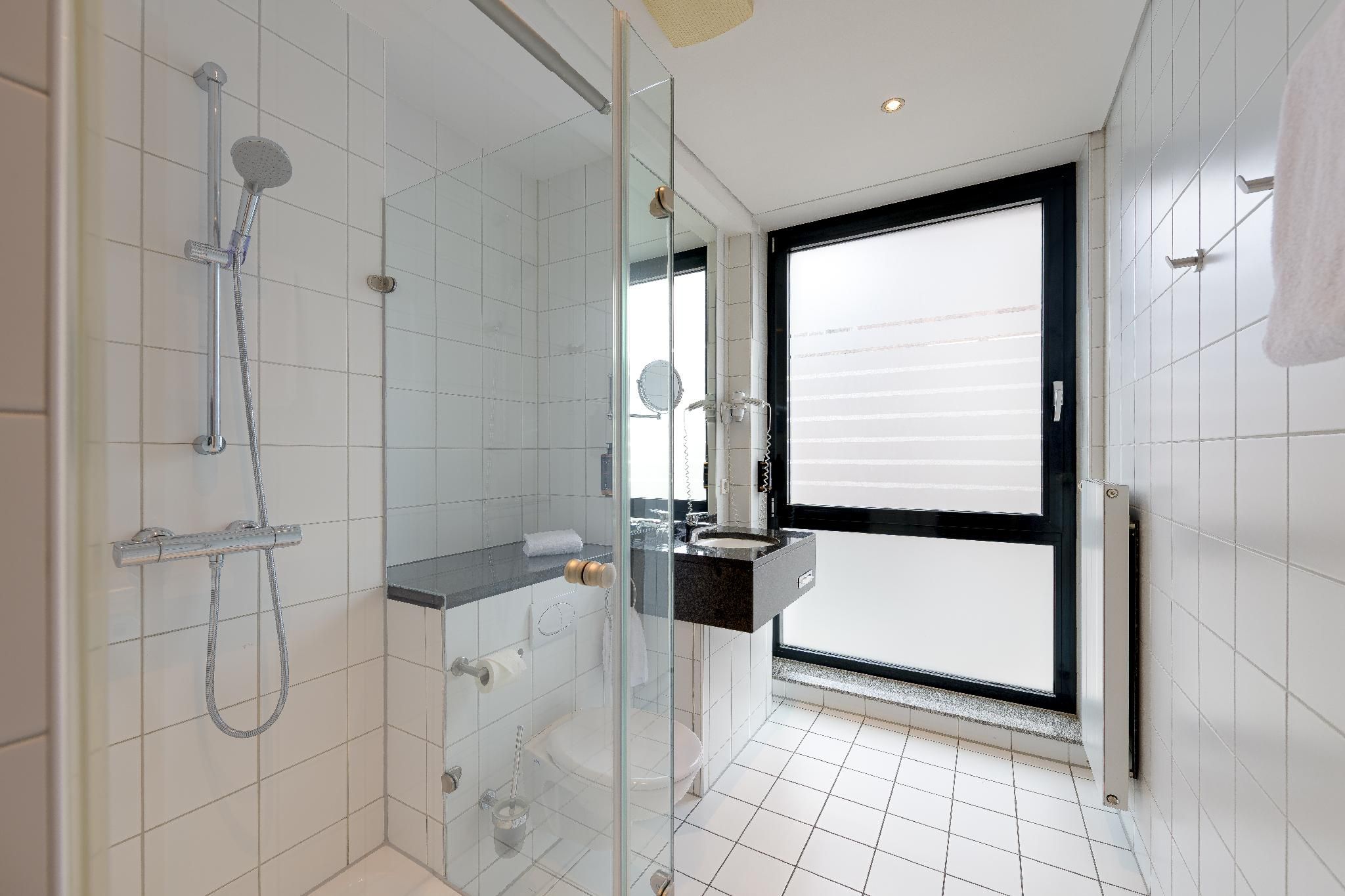 Privilege Room with double bed and sofa