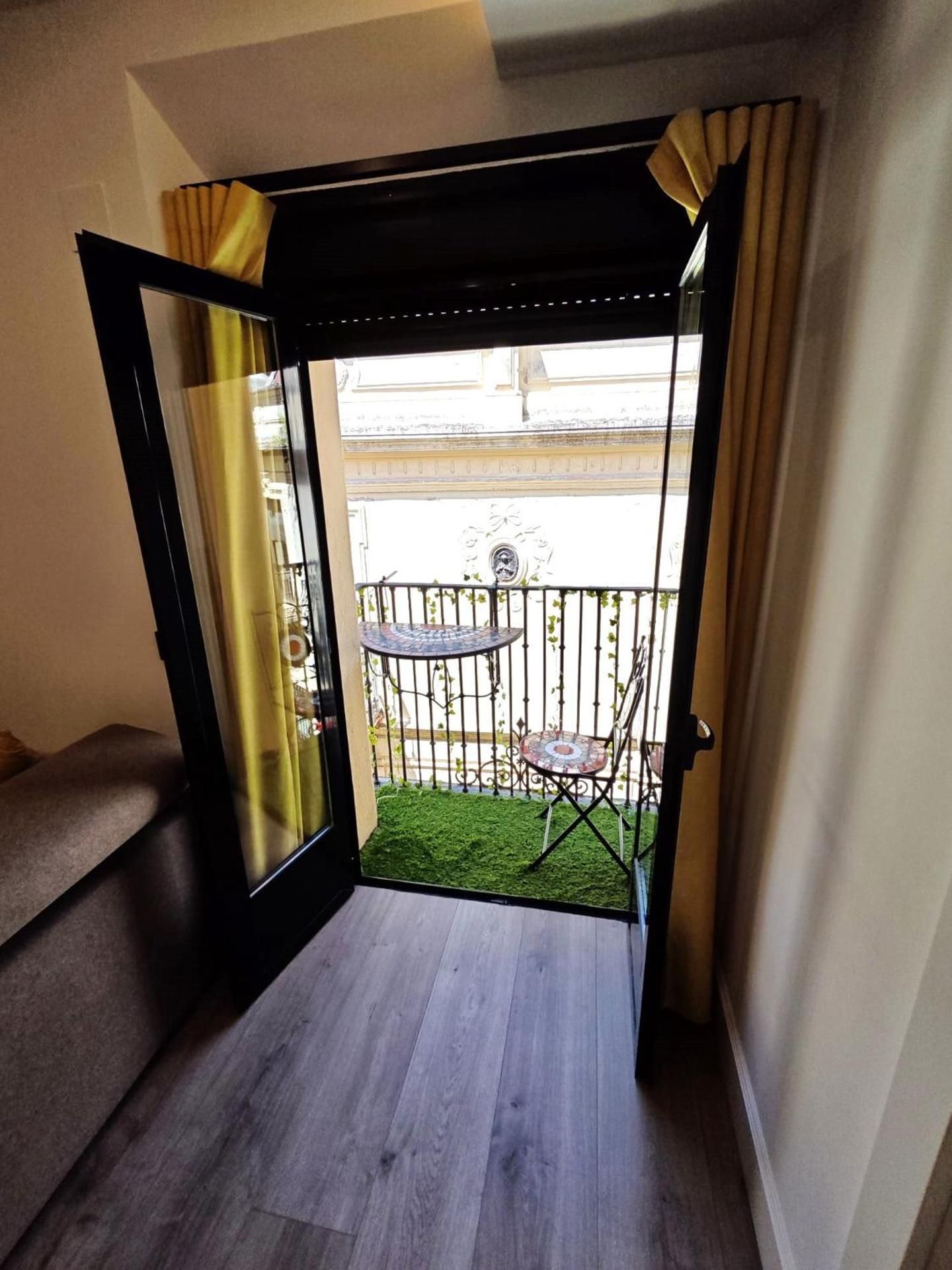 One-Bedroom Apartment with Balcony and City View