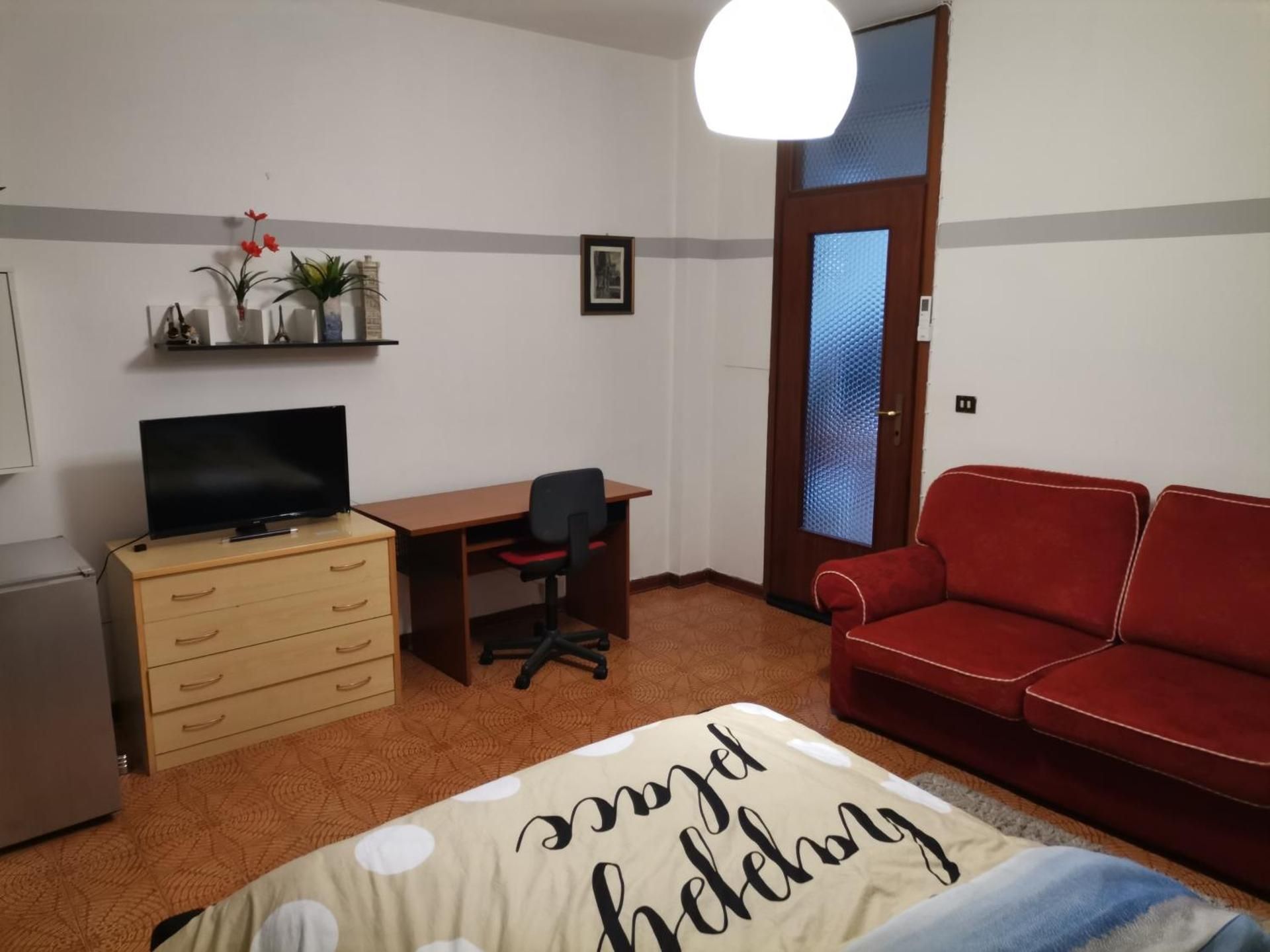 Ampia camera con balcone privato