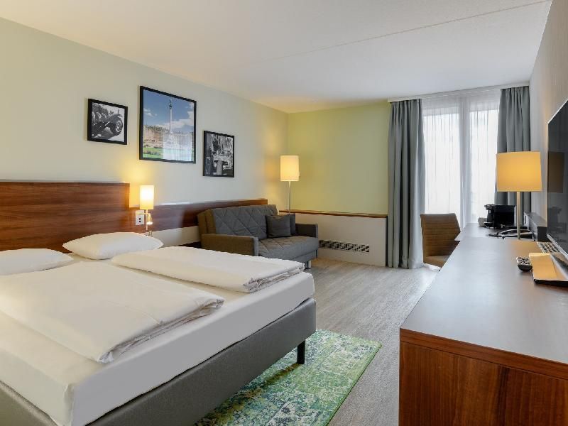Mercure Hotel Stuttgart Sindelfingen An Der Messe Standard Room With Queen Size Bed And Sofa