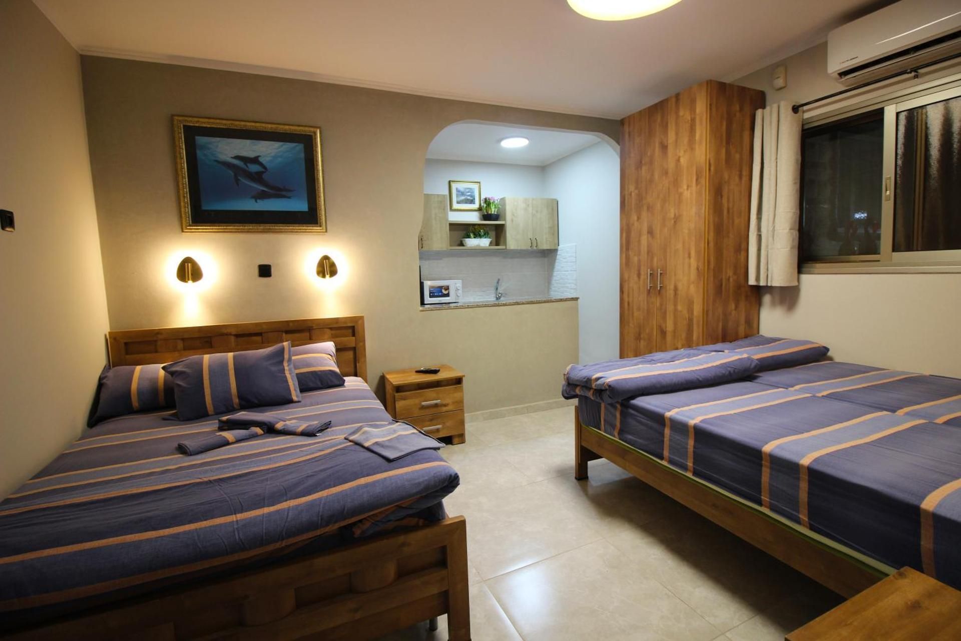 Sunset Inn Family Room (2 Adults + 2 Children)