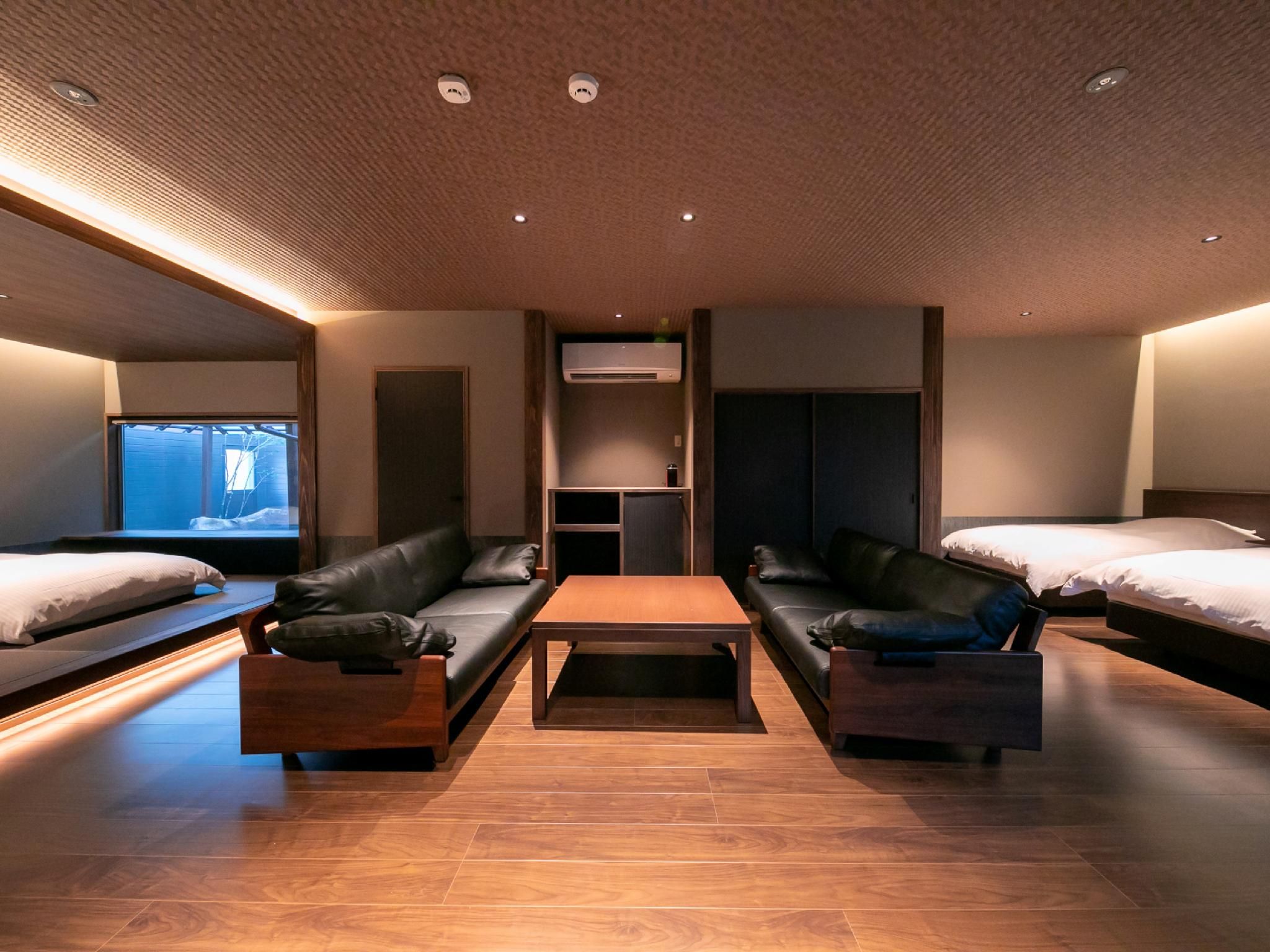 Suite with 4 Single Beds and Private Rock Bath - Non-Smoking