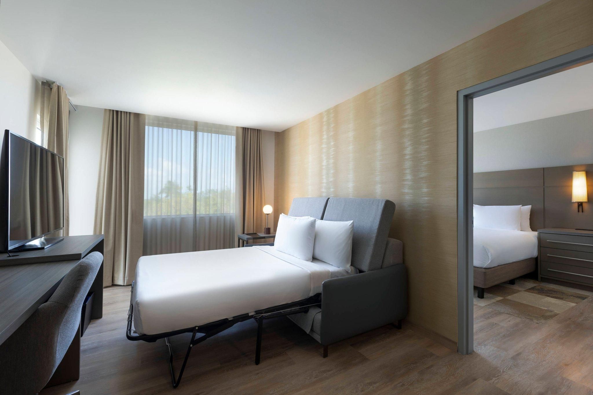 2 Bedroom Suite, Bedroom 1: 1 King, Bedroom 2: 1 Queen, Sofa Bed, Balcony