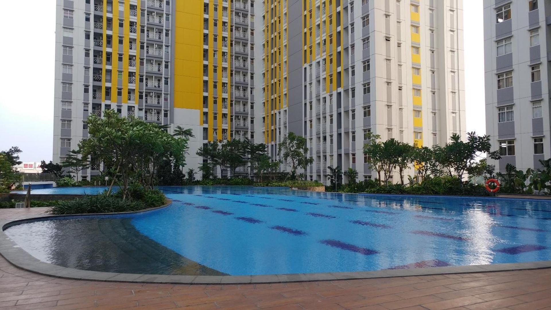 Lovely 2BR Apt @ Springlake Summarecon By Travelio