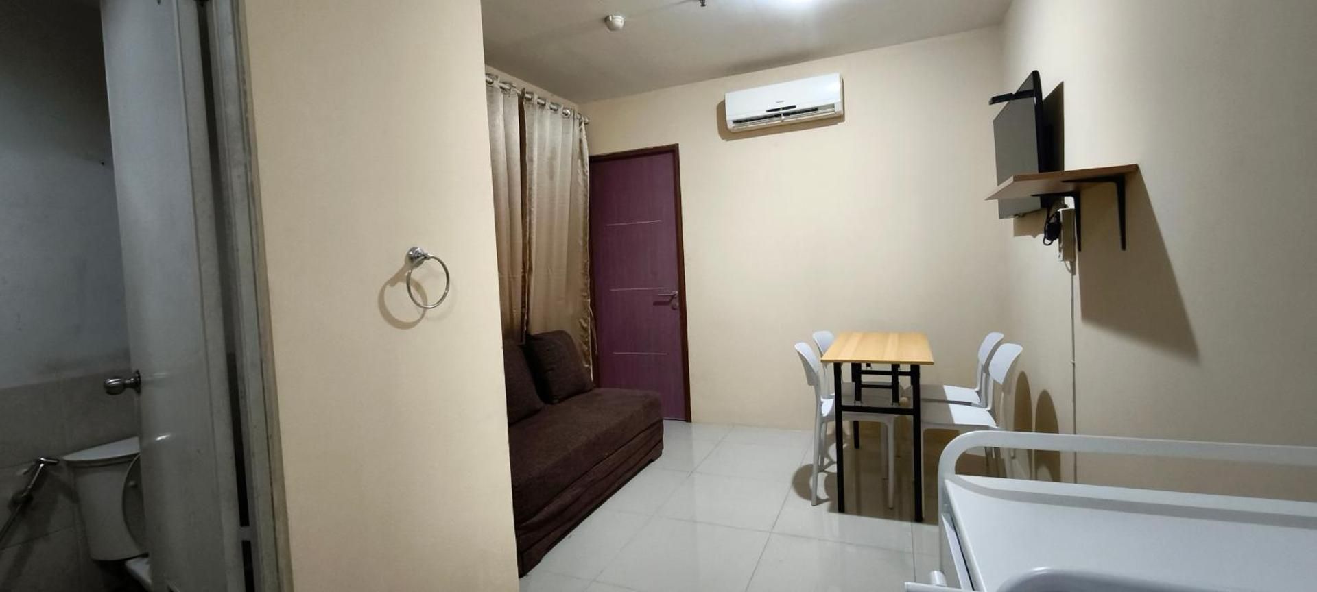 One-Bedroom Apartment with Balcony and City View