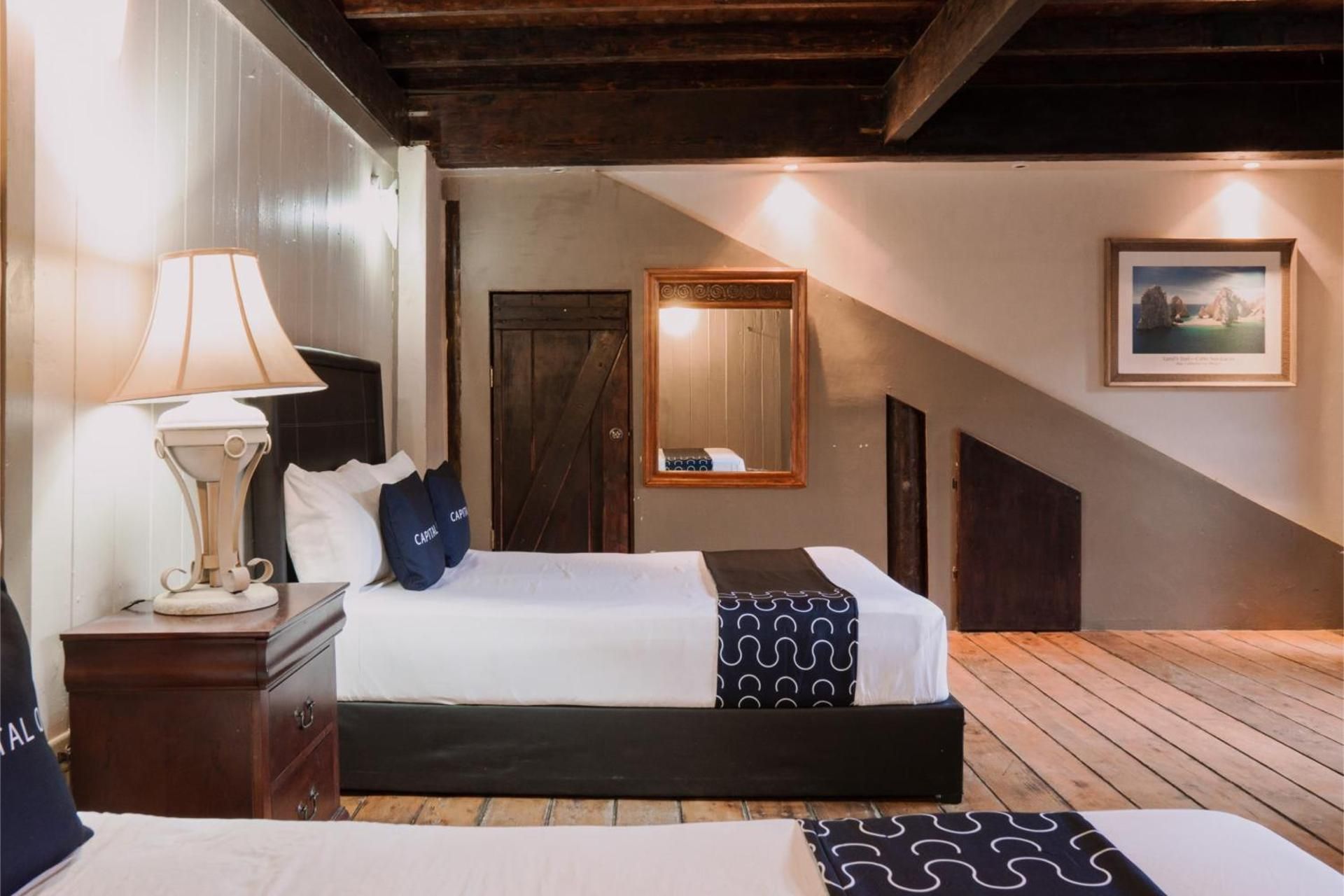 Capital O Hotel Villa Azura Standard Quadruple Room