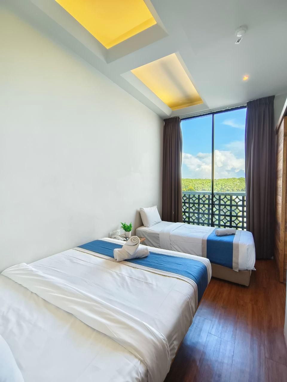 Riverbank Hotel by MRVJ BUSINESS Riverfront Family Room 2