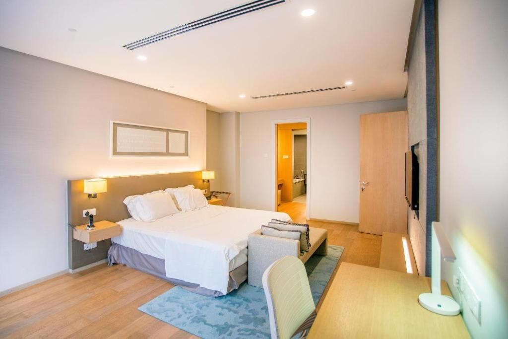 One-Bedroom Apartment with Balcony and City View