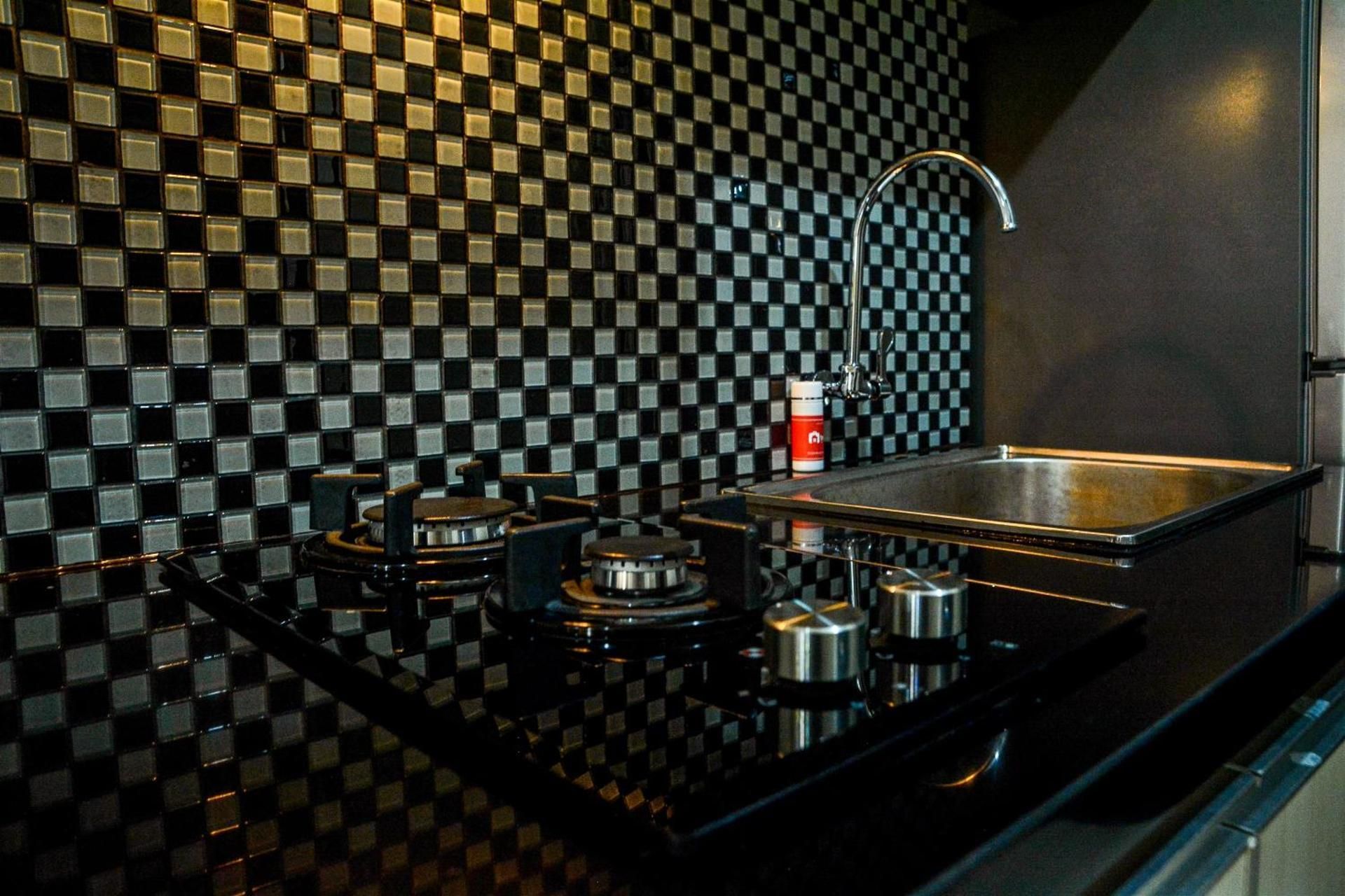 Studio Room at Grand Serpong Apartment By Travelio