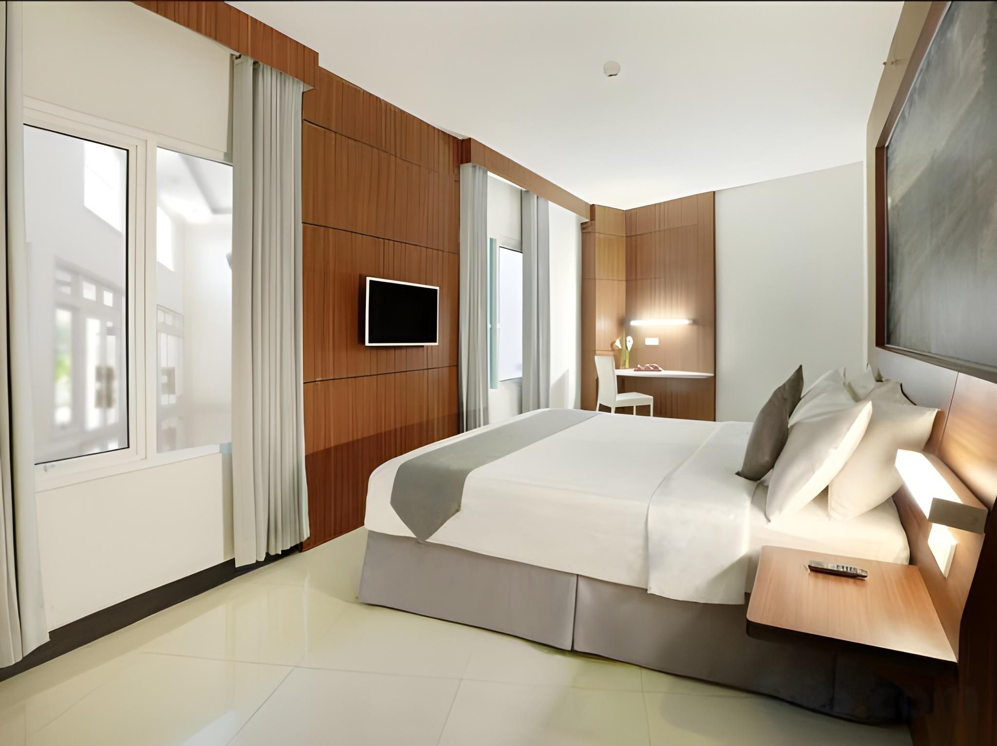 Hotel Neo Palma - Palangkaraya by ASTON Deluxe Room 2