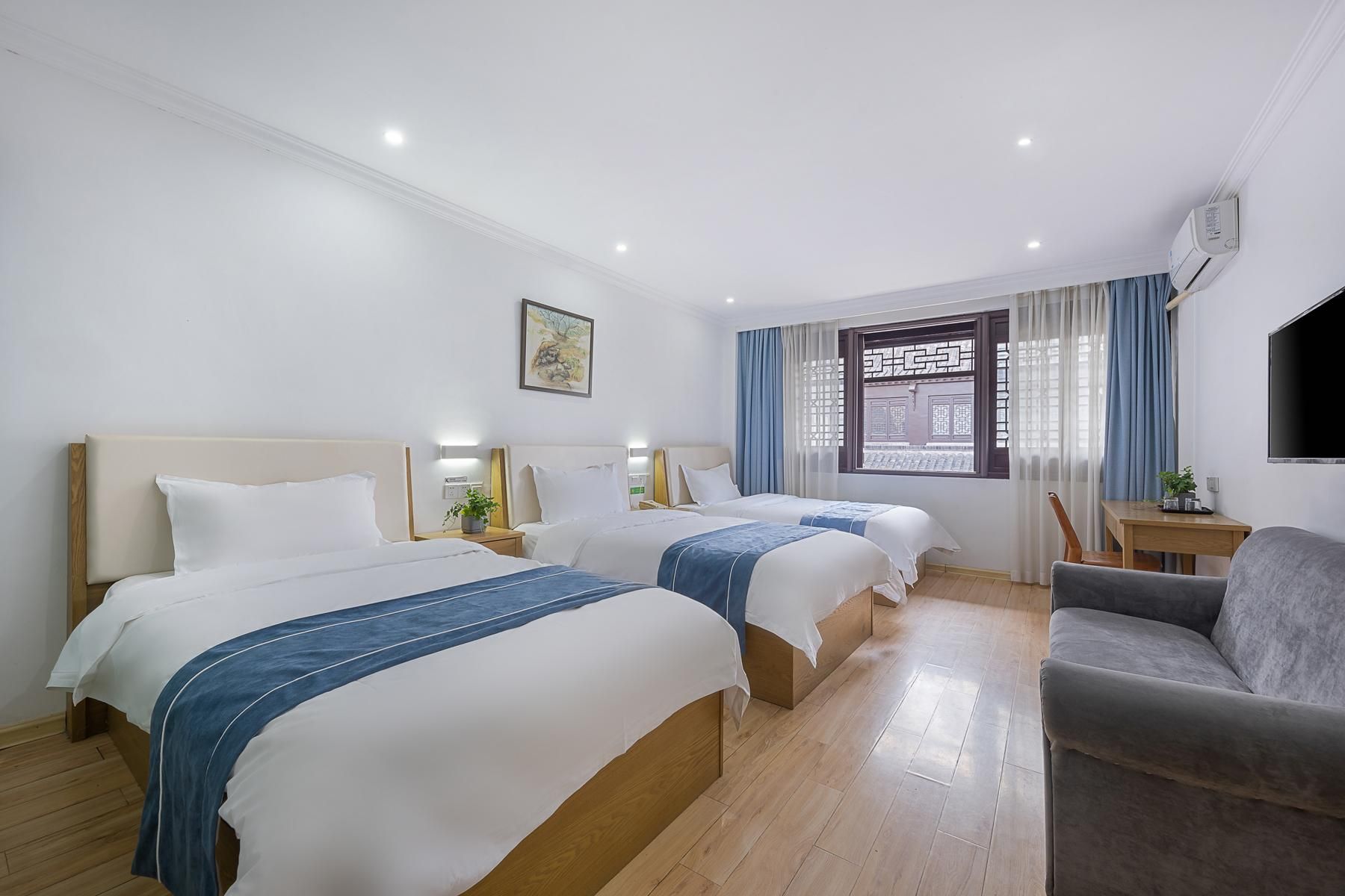 Triple Bed Room With Air Conditioning