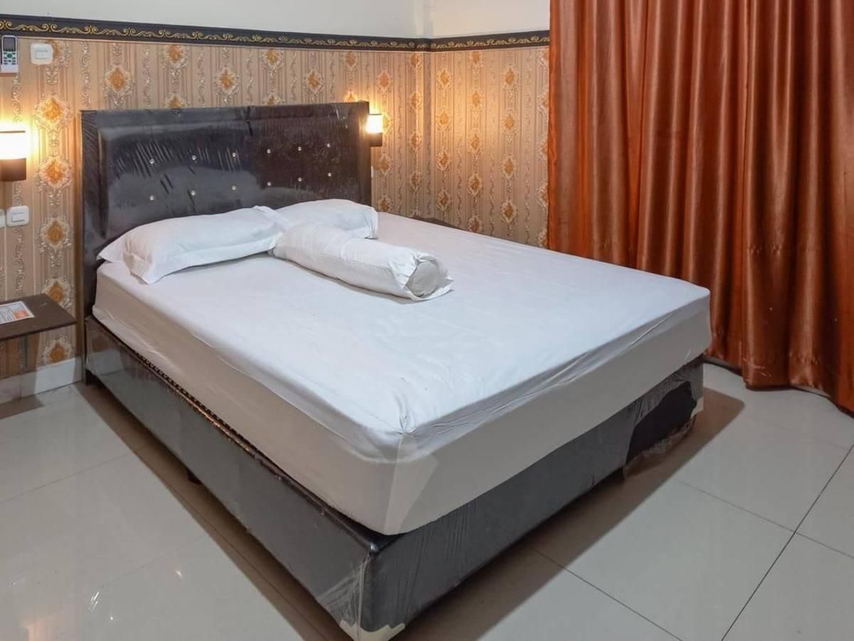 Homestay Singgasana Mitra RedDoorz Promotion Room