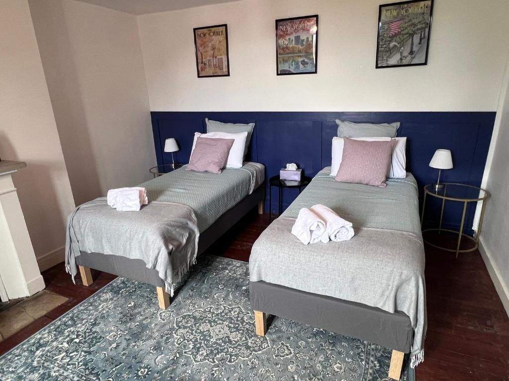 Chambre (2 lits simples) / salle de bain partagée